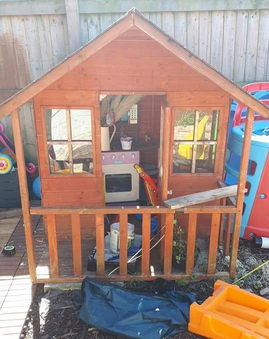  The Wendy house was previously brown in colour and used to store junk