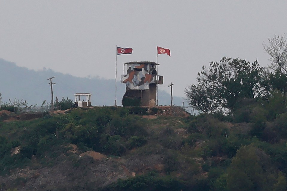  A North Korean flag flutters in the wind at a military guard post in Paju, at the border with North Korea on Sunday