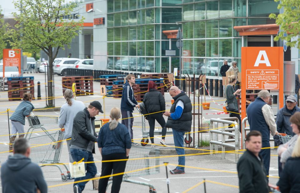  Some shops such as hardware stores have already reopened. People queuing at a B&Q in Loughborough on May 3