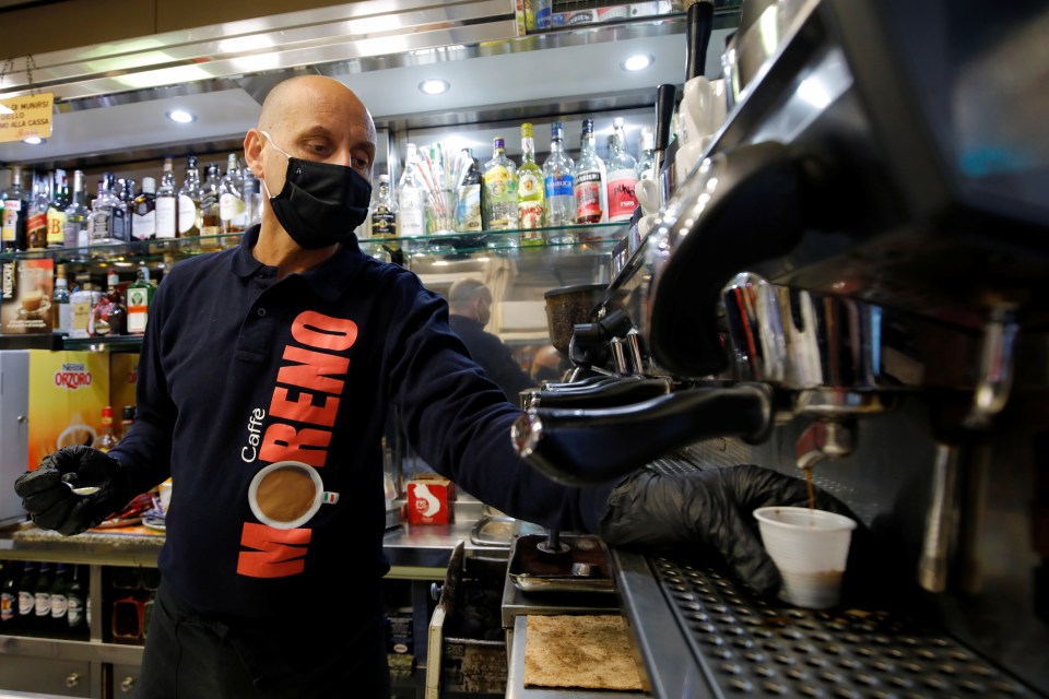  A barista prepares a coffee at a cafe in Naples