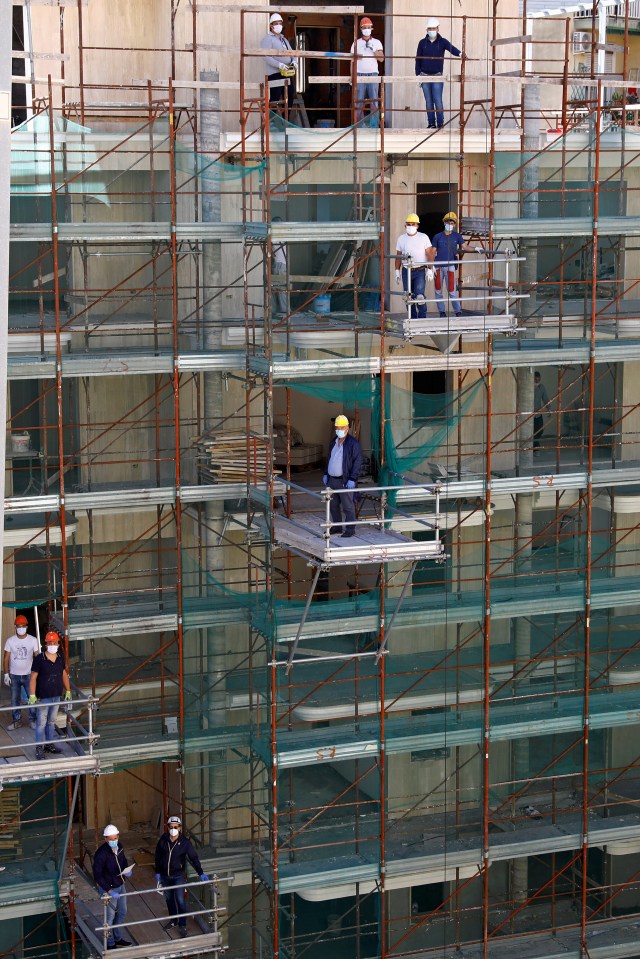  Construction workers at a site in Catania back at their jobs