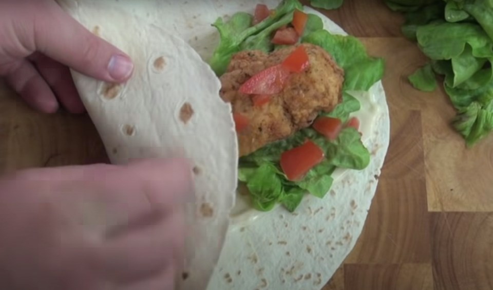 A peppery mayo and a salad garnish go into the tortilla wrap