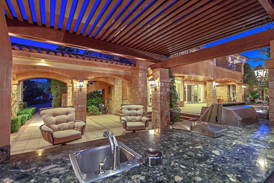 An outdoor fireplace and barbecue make the home ideal for entertaining guests and al-fresco dining