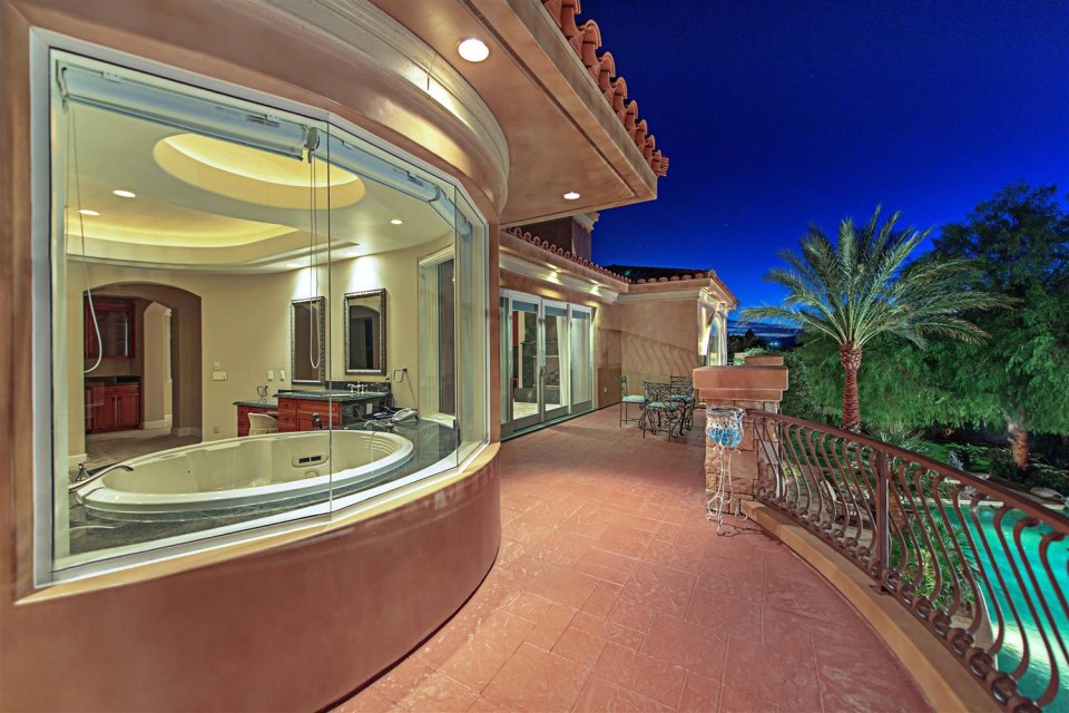 The master suite has a step-in tub and private balcony