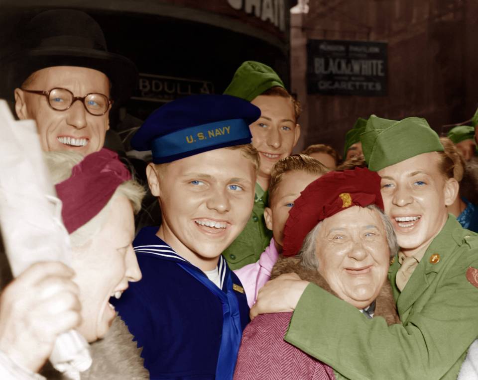  A young American soldier hugs an elderly English lady as all of London turns out to celebrate VE Day