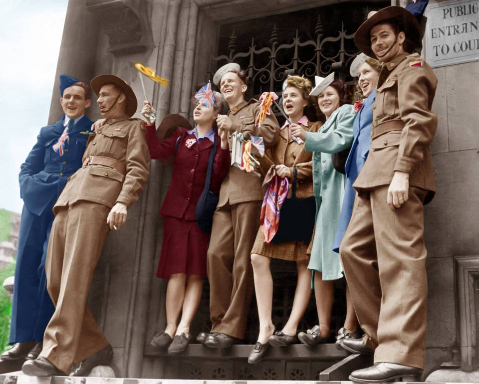  A group of friends watch the celebrations wearing hats that say "It's lurve I want" and "Will I do?"