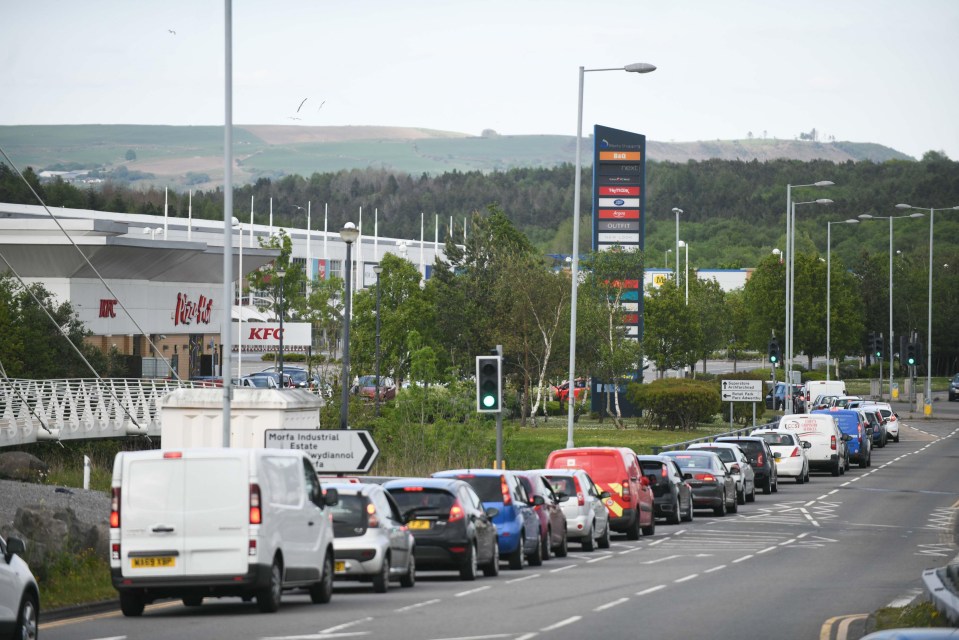 Queues in Swansea wrap around one KFC, despite the chain urging customers to continue to order online still if they can to avoid people making unnecessary journeys