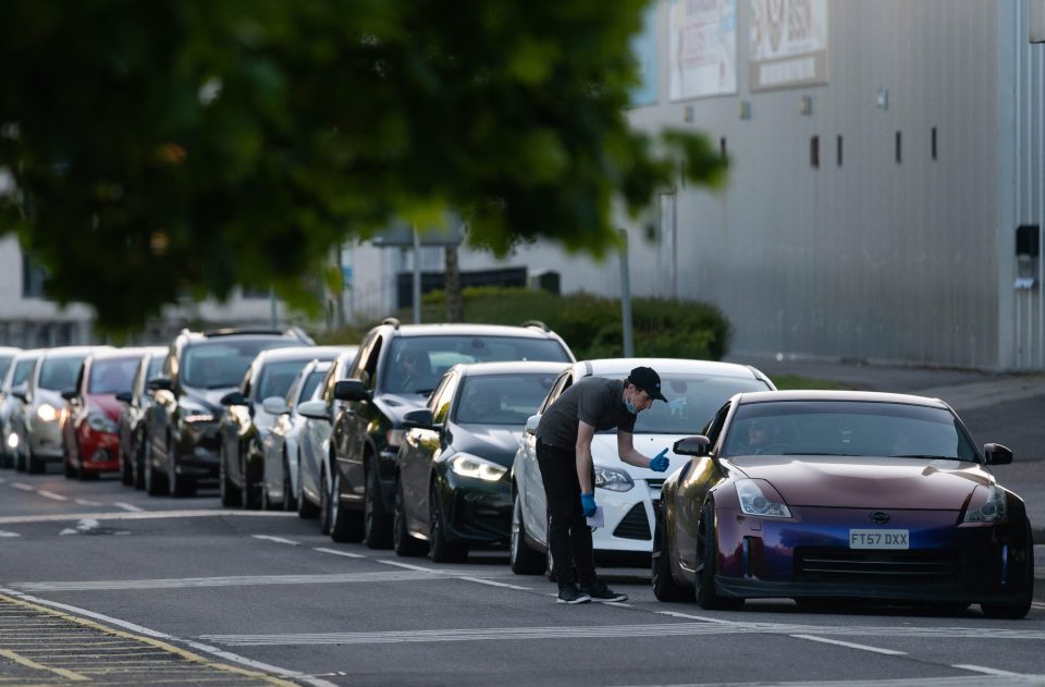  KFC workers were delivering orders to those waiting in the queues in Basingstoke, Hants.