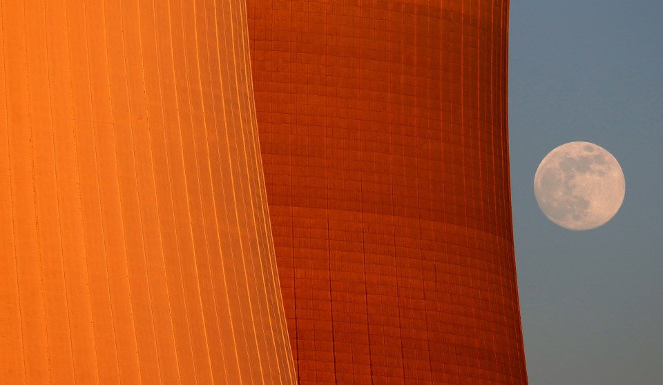  The Flower Moon rises behind the nuclear power station in Philippsburg, Germany