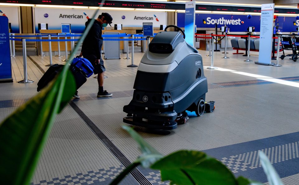  A UV cleaning robot cleans the floor near the ticketing windows at Pittsburgh International Airport on May 7