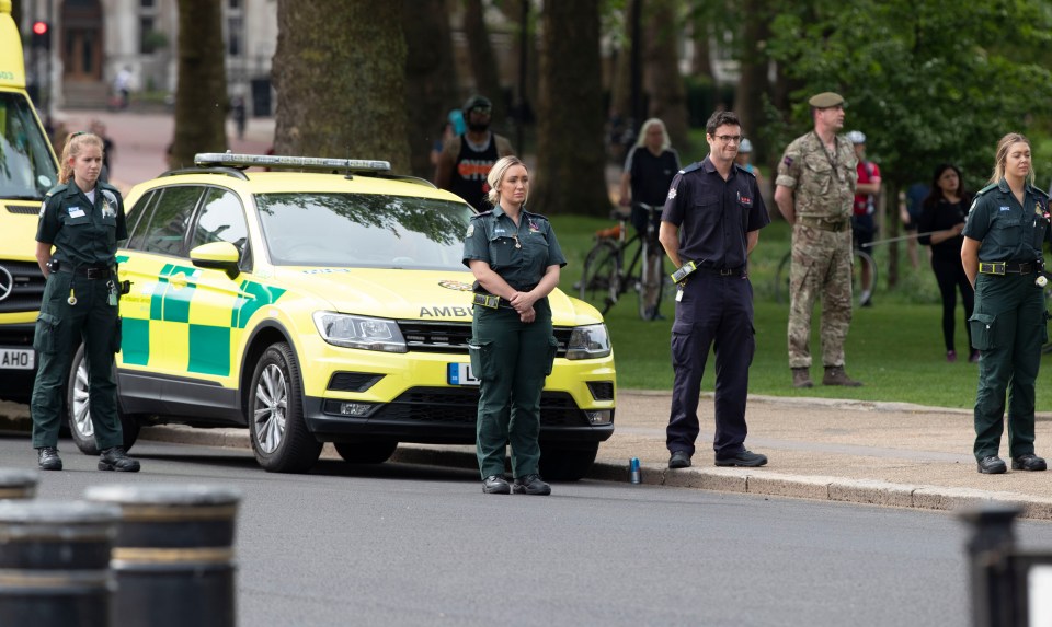  An ambulance crew pay their respects at Horse Guards in London