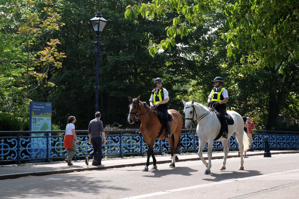  Police officers on horses are seen in Victoria Park