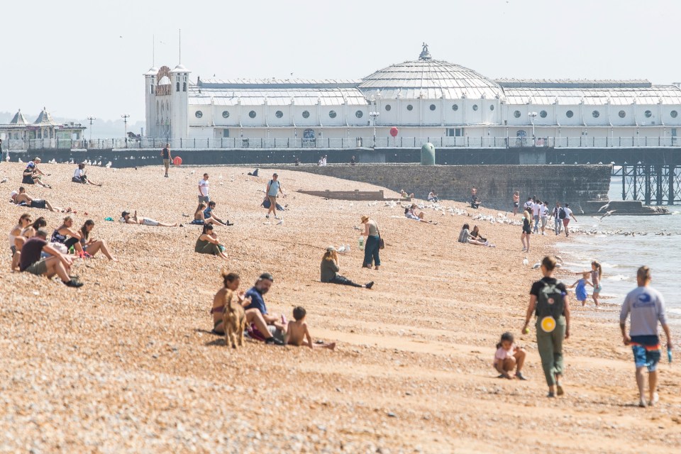  People try to maintain social distancing at the beach