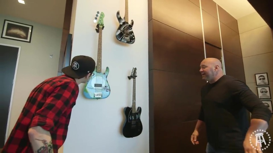 Bass guitars including one that belonged to Flea from the Red Hot Chilli Peppers also hang from the wall