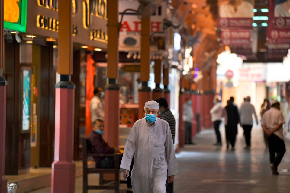 A shopper in a face mask at a luxury mall in Dubai, UAE