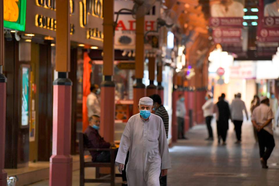  A shopper in a face mask at a luxury mall in Dubai, UAE