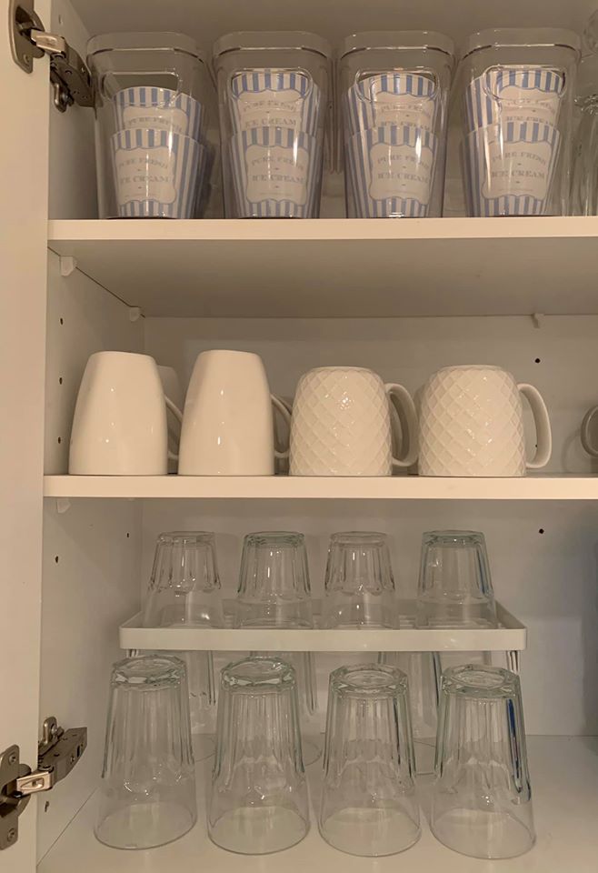 Her glass and mug cupboard looks like it could be a shop display thanks to being perfectly lined up