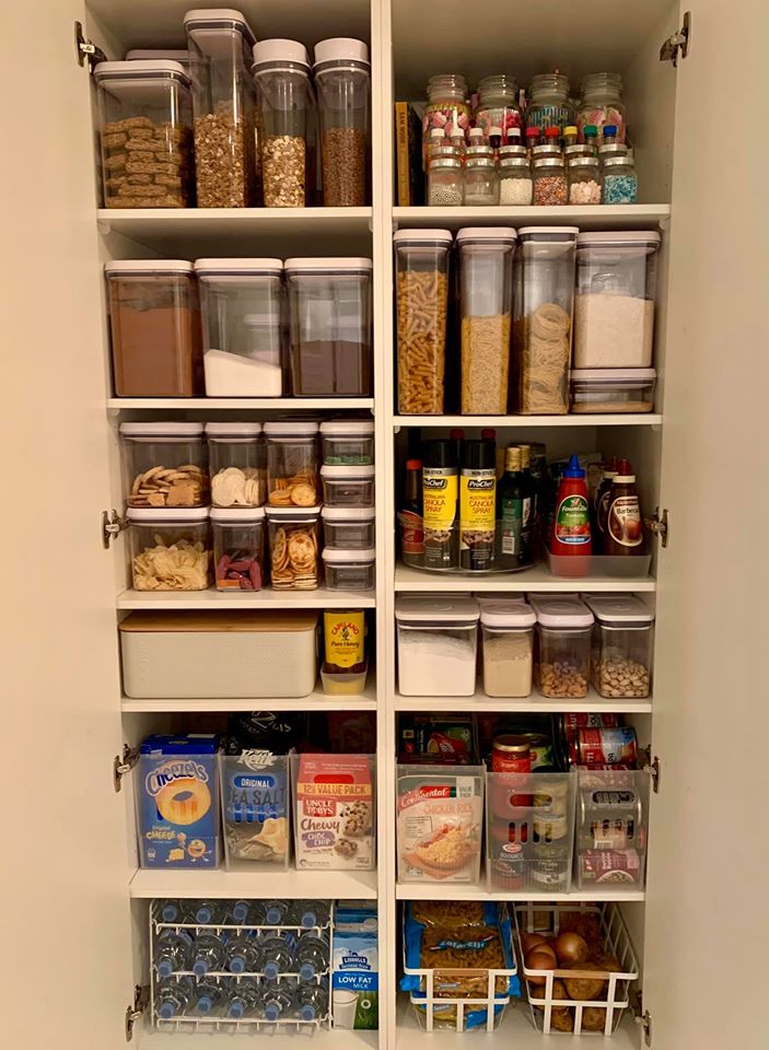 Her pantry contains food in boxes and clear storage containers