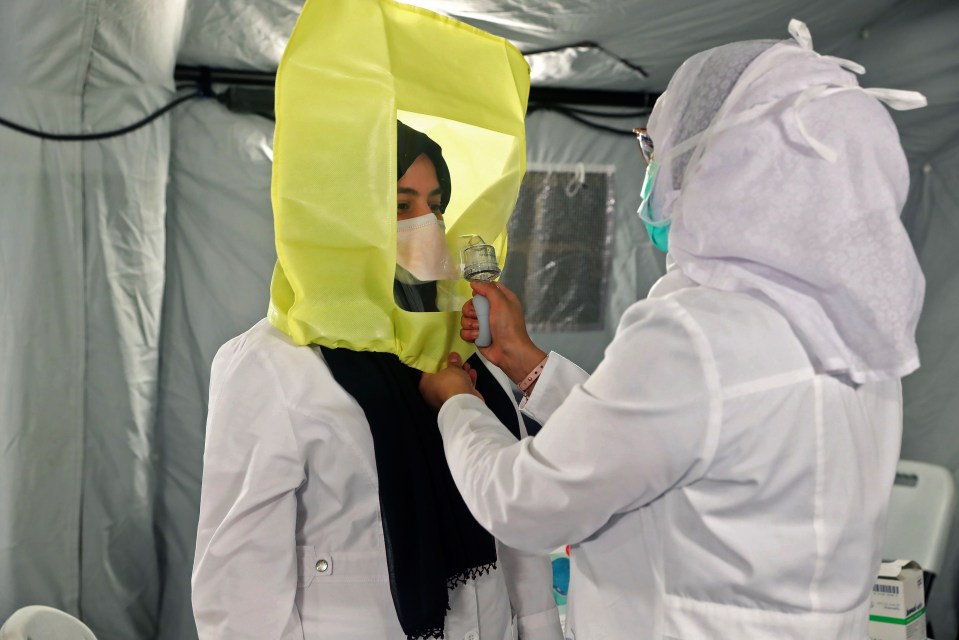 A patient is tested at a coronavirus field hospital in Mecca, Saudi Arabia