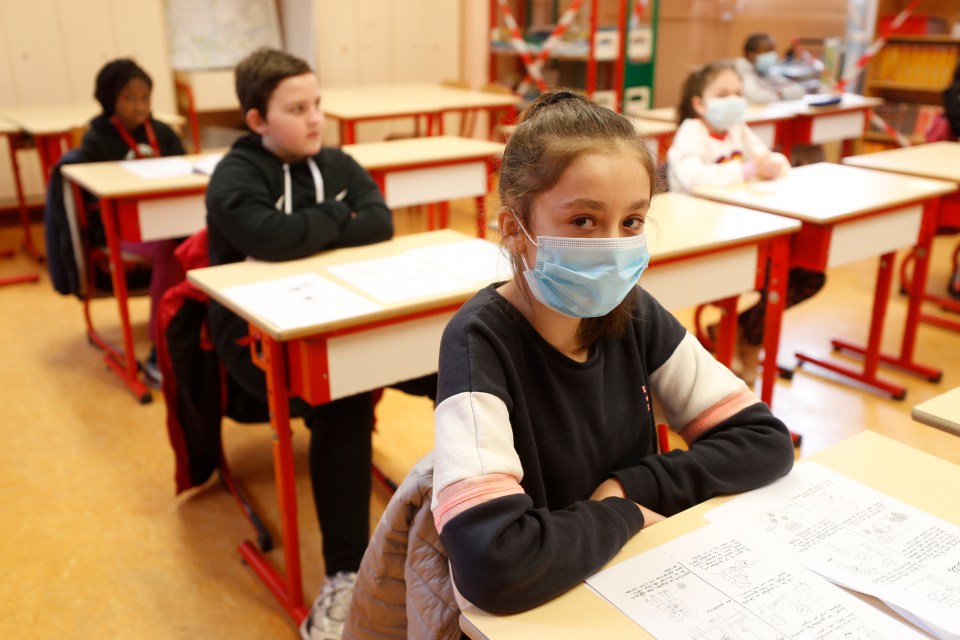  French schoolchildren wearing masks take their place in class as the country's schools reopen after the Covid-19 shutdown