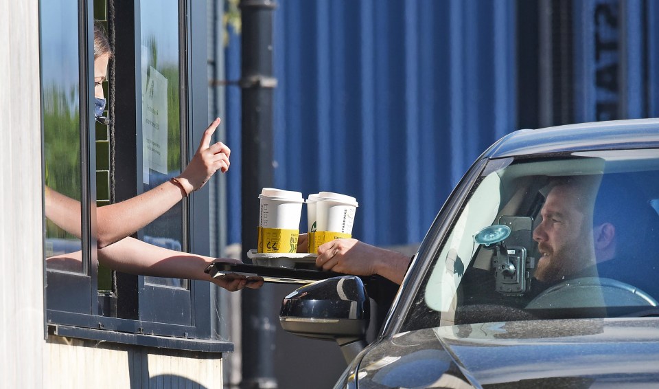 Coffee fans queue up to get their Starbucks caffeine fix