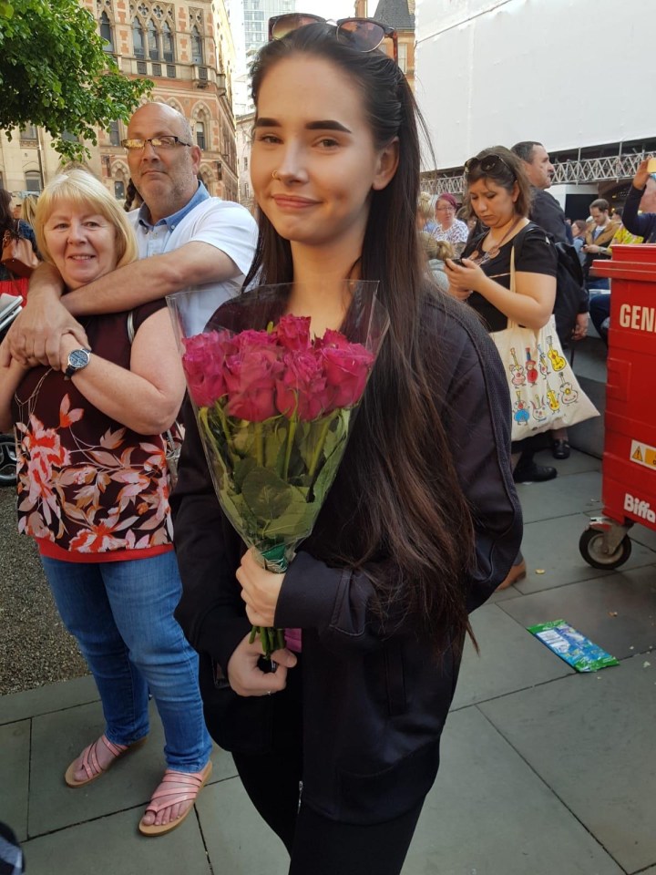 Scarlett leaving a tribute to those who died in Manchester, three years ago today