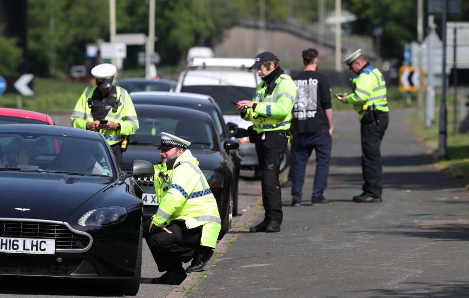  Police carry out vehicle stop-checks on the A23 north of Brighton as motorists make their way to the coast