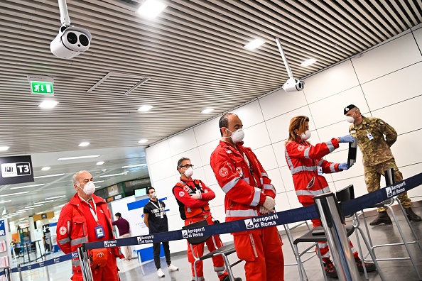  Red Cross volunteers prepare to supervise body temperature scanning on arriving passengers with special cameras on May 5