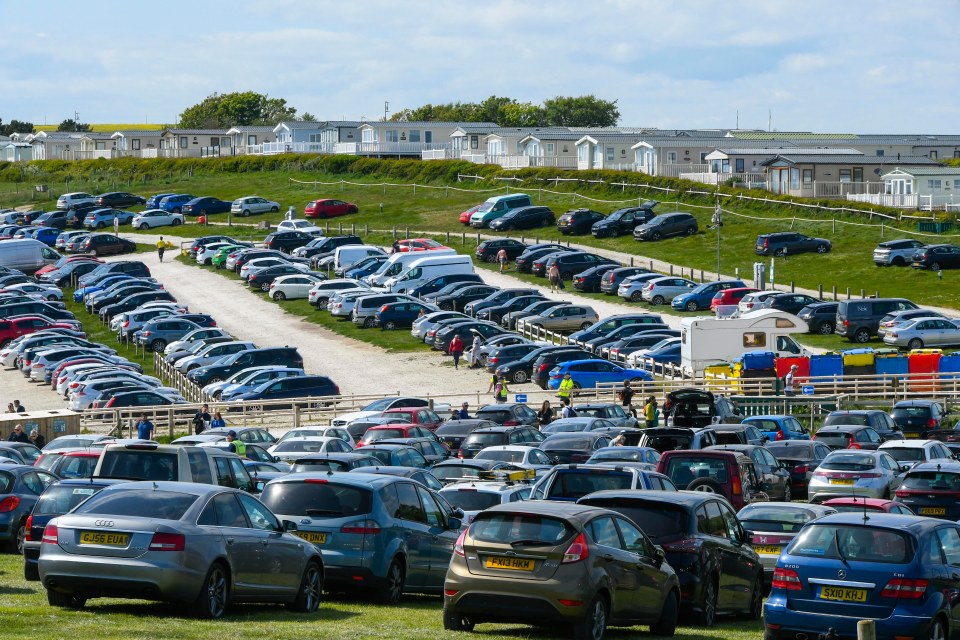 Pictures today show car parks full at scenic Durdle Door