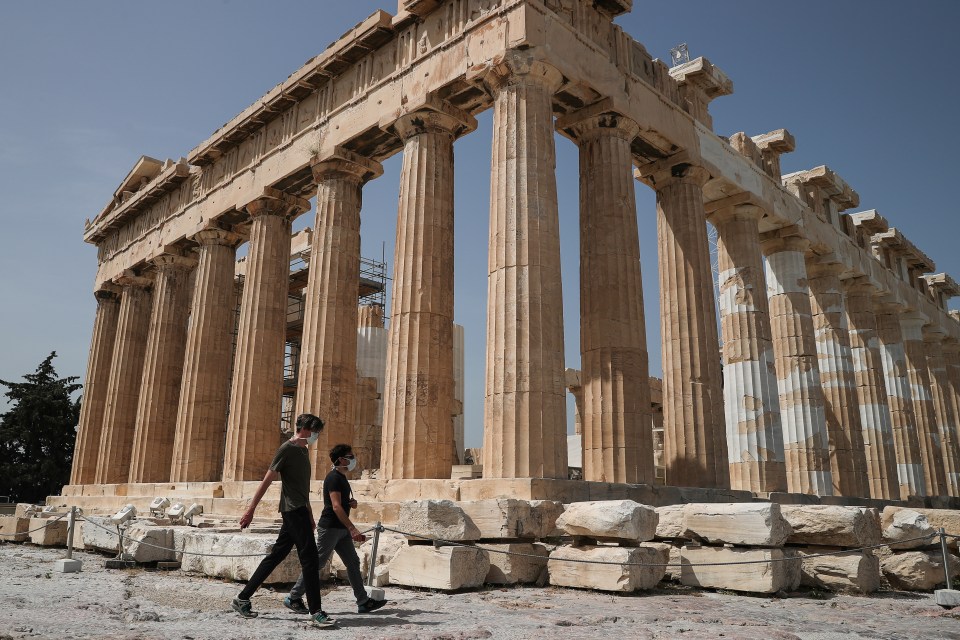  Visitors wear protective face masks as the Acropolis archaeological site opens to visitors