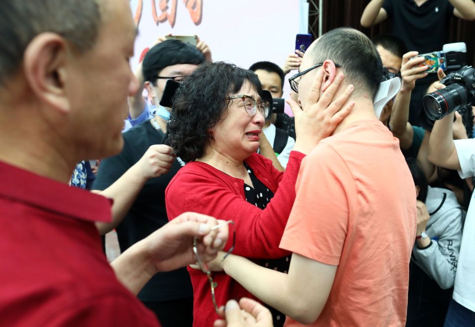  Mao Yin (R) was reunited with his mother Li Jingzhi (C) and father Mao Zhenping (L) after a DNA test matched them