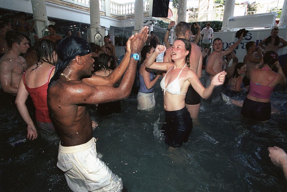  Partygoers dance in a swimming pool in Es Paradis in 2001