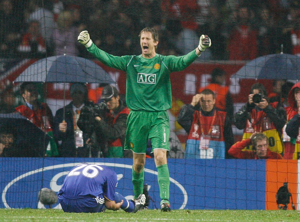  Van Der Sar celebrates as Terry lies in a crumpled heap