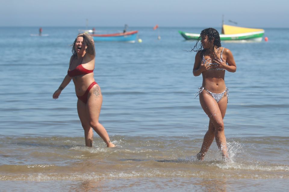  Sorrell Vince, 23, left, from Northampton and Bethany Heatley, from Preston, enjoying the sun on Cullercoats Beach, Tynemouth