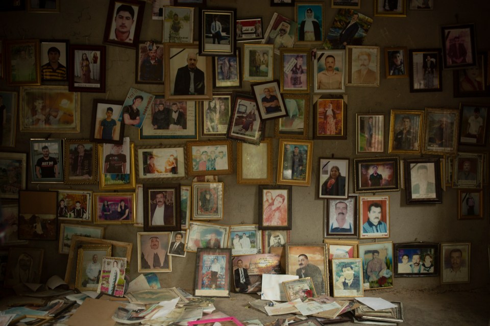 Pictures of Yazidis killed by ISIS in 2014 hang in a small room at the Lalish shrine in northern Iraq