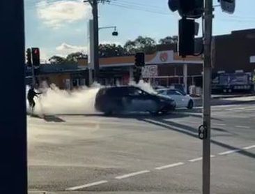  The car is seen speeding away before smashing into the shop