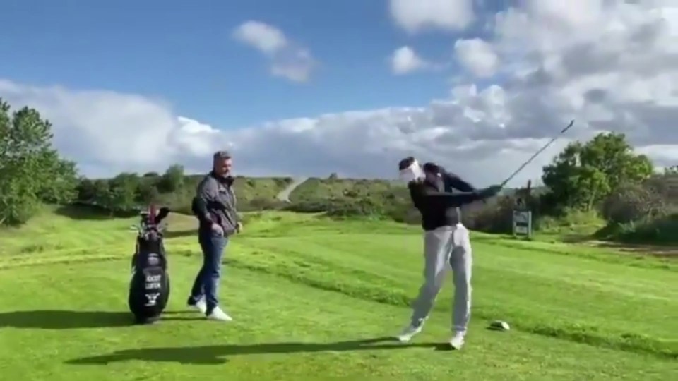  This is the moment a golfer 'almost killed' his girlfriend during practice swings