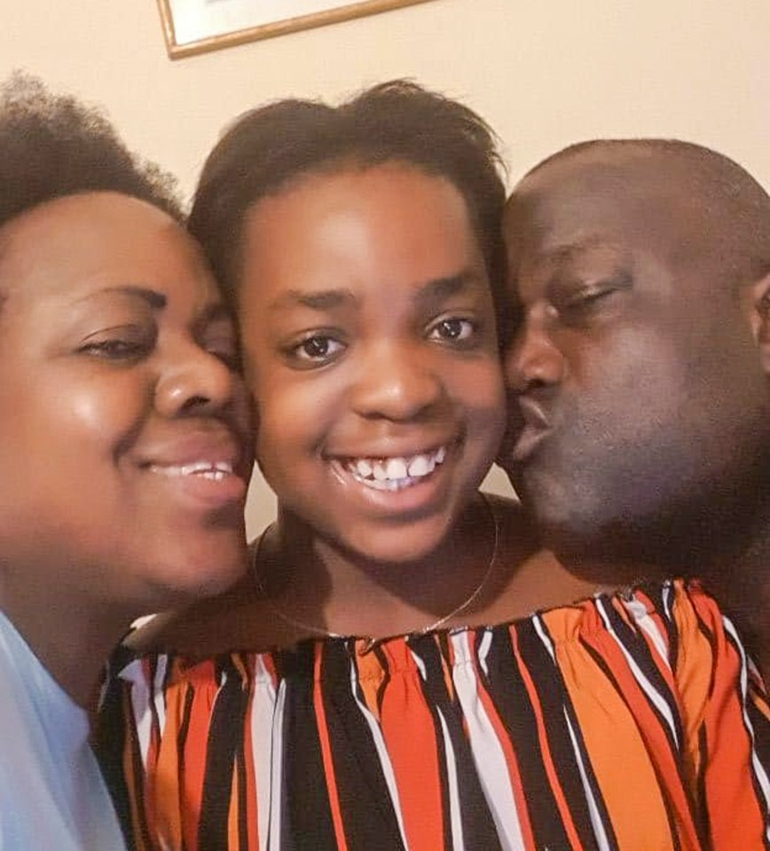 Mrs Mujinga, pictured with her husband and daughter, reportedly suffered respiratory problems