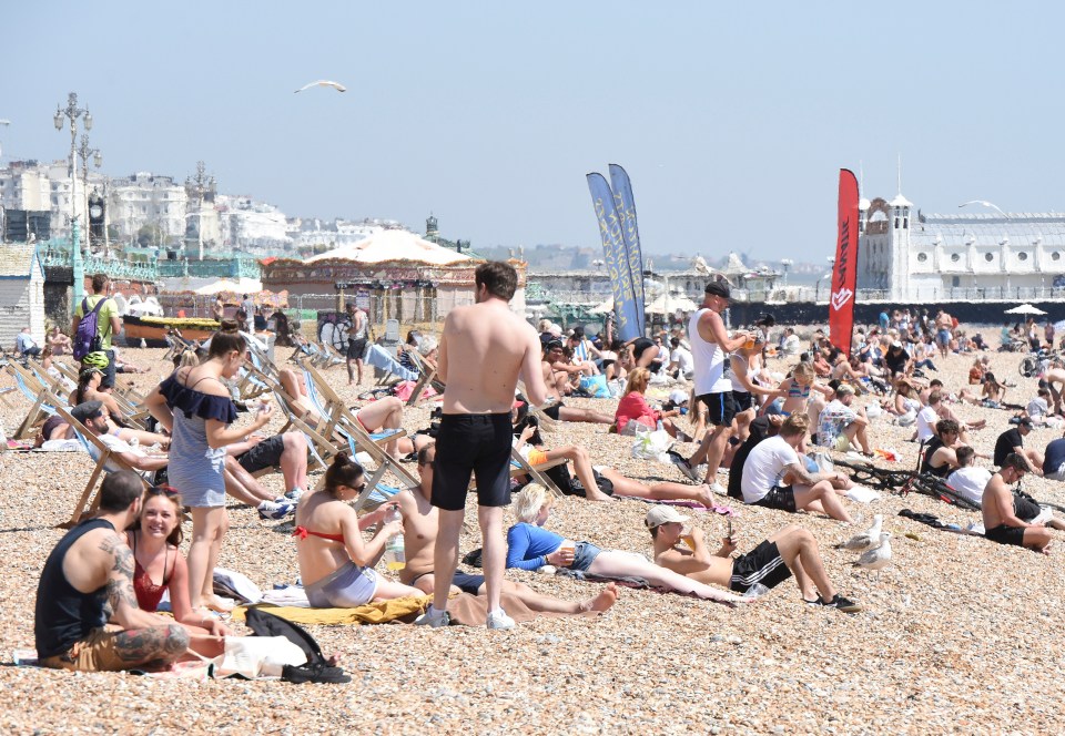 Sun-seekers flocked to the beach as hot weather hit the UK