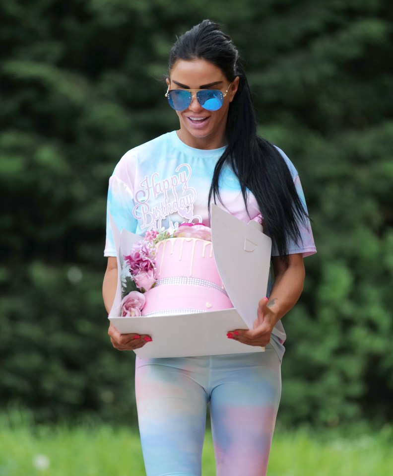  Katie Price picks up huge pink cake for her 42nd birthday as her son Junior jokes she’s ‘getting old now’