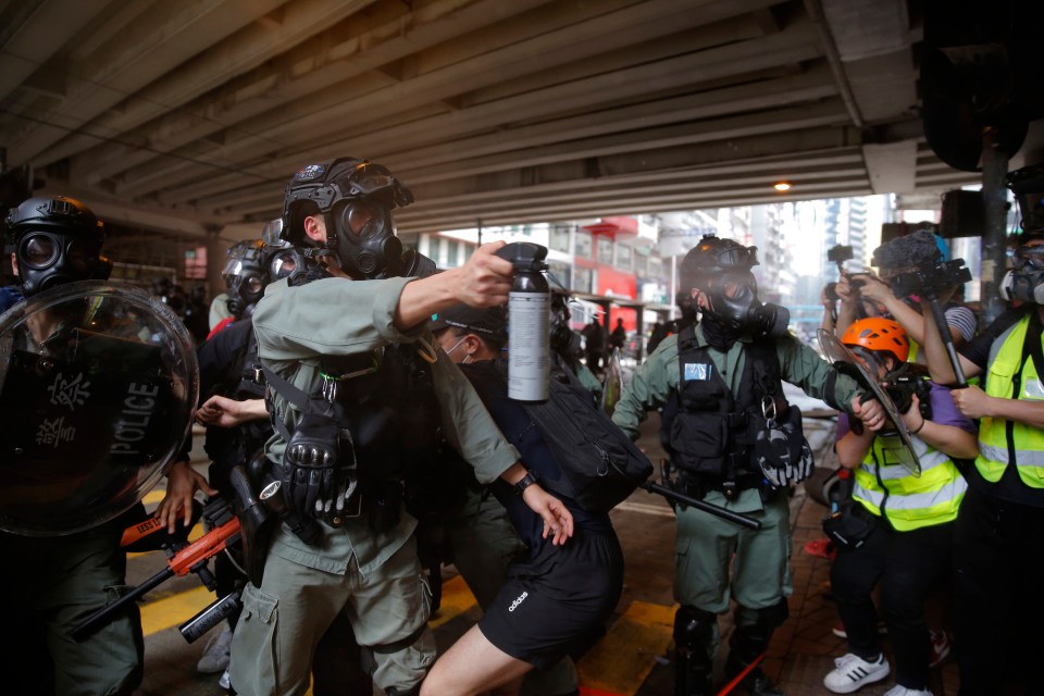  Riot police fired tear gas and water cannons at protesters in Hong Kong