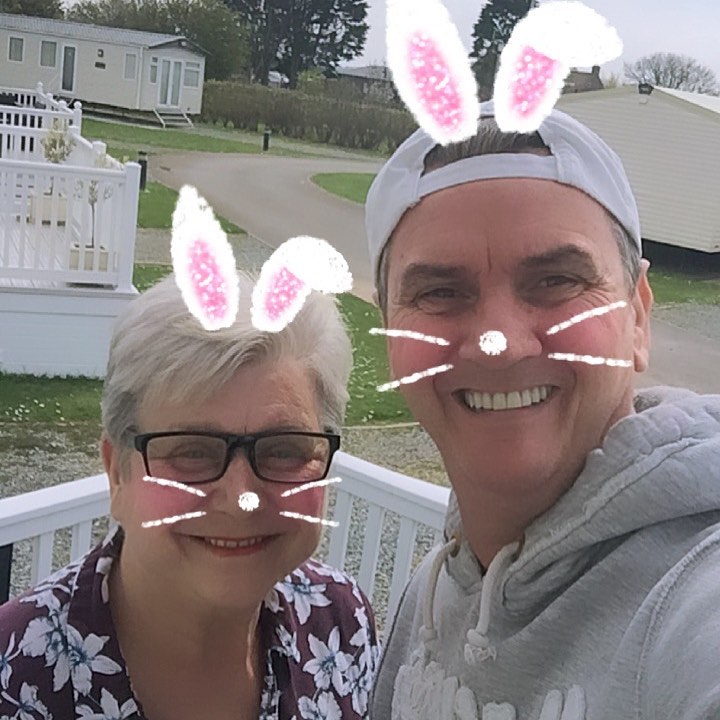 Jenny and Lee on the balcony of the caravan - a control room is set up in a van outside when they're filming