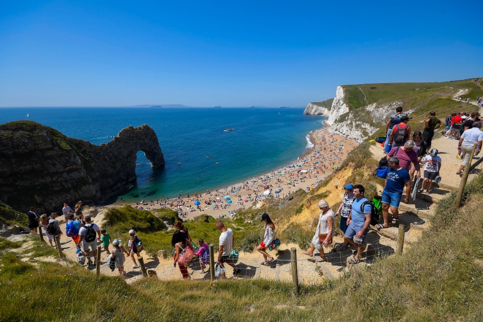 Thousands headed for Durdle Door, in Lulworth, Purbeck, as temperatures soared today