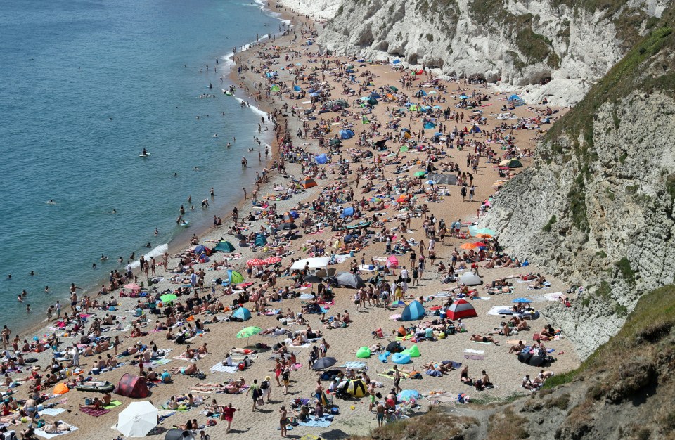 The beach at Durdle Door was heaving as the mercury rose today