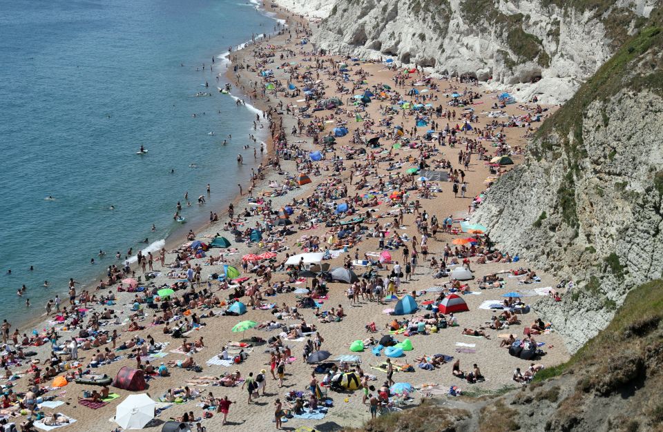  The beach at Durdle Door was heaving as the mercury rose today