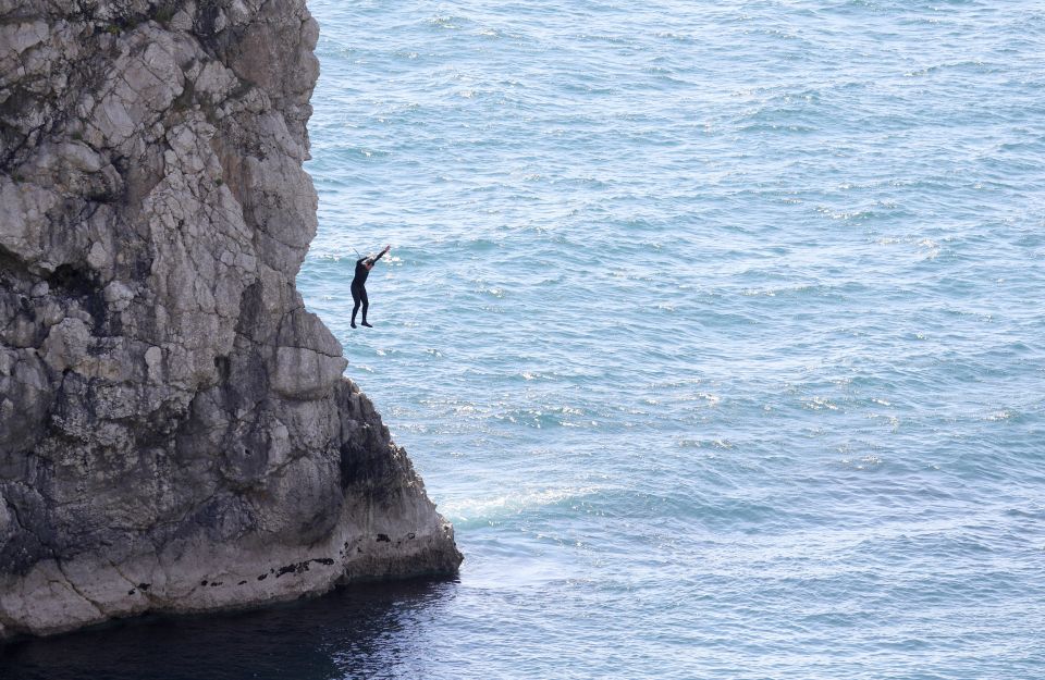  A man recklessly launches himself from the clifftop on Sunday