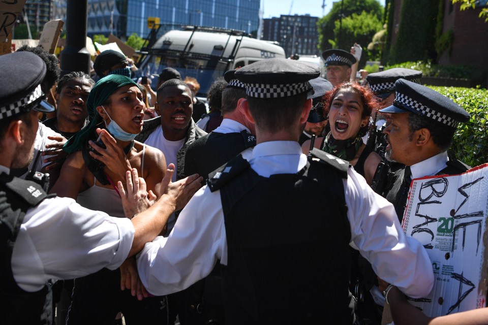  Protesters clash with police during a demonstration at the US Embassy in London