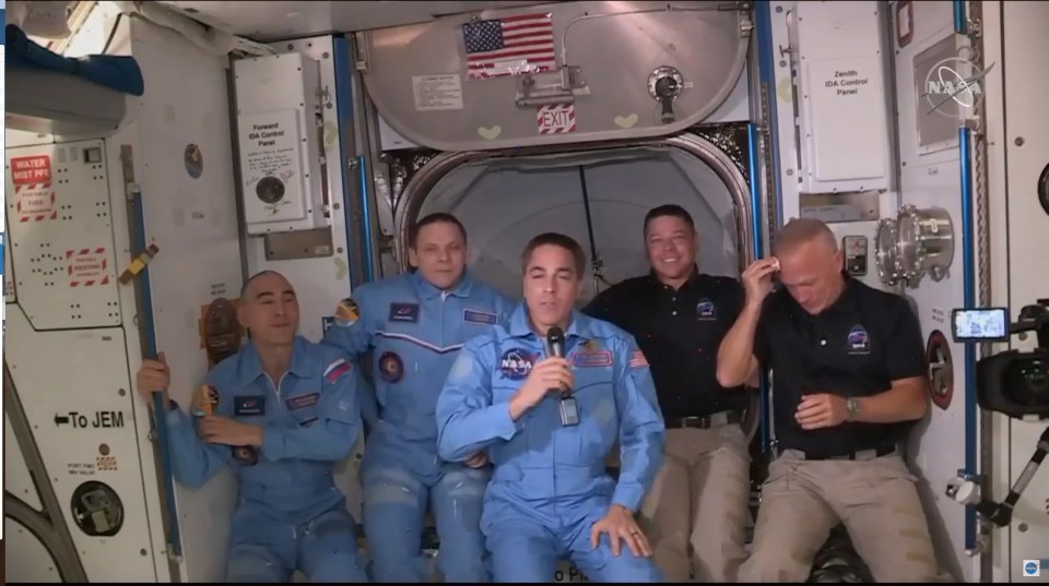 The SpaceX crew members (right) were met by current residents, NASA’s Chris Cassidy and Russians Anatoli Ivanishin and Ivan Vagner