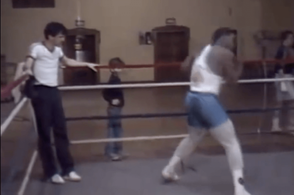 Atlas watches over as Tyson shadow boxes in the ring