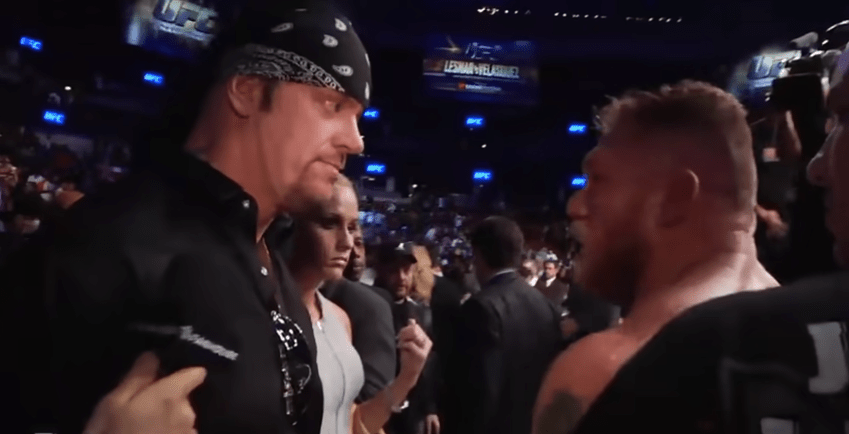  The Undertaker and his wife Michelle McCool confront Brock Lesnar at UFC 12